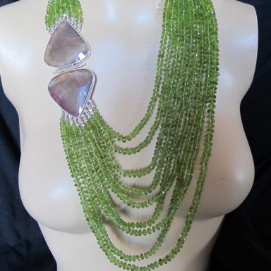 7 strand Peridots with sapphire clasp