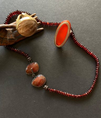 Hessonite garnets, carnelian ring and rutile quartz ring